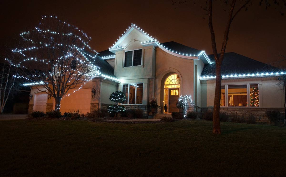 Cool white lights installed on home and trees
