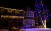 Icicle lights ion two story roof line with multi-color tree drape in St. Paul, Minnesota